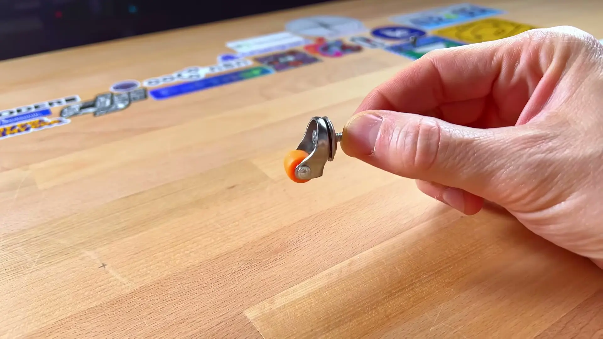 RackMate held upside down, showing the installed orange casters