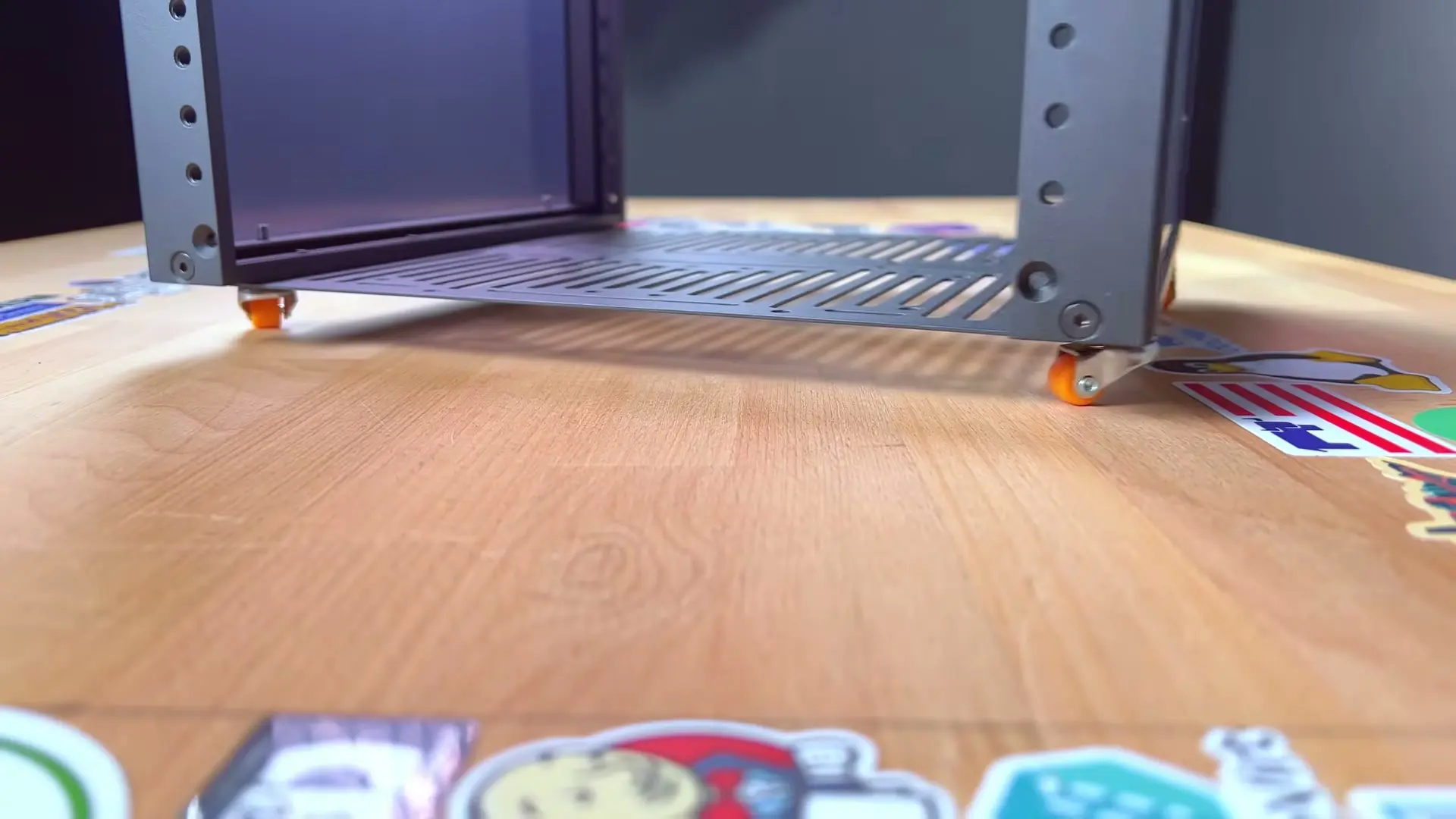 RackMate held upside down, showing the installed orange casters