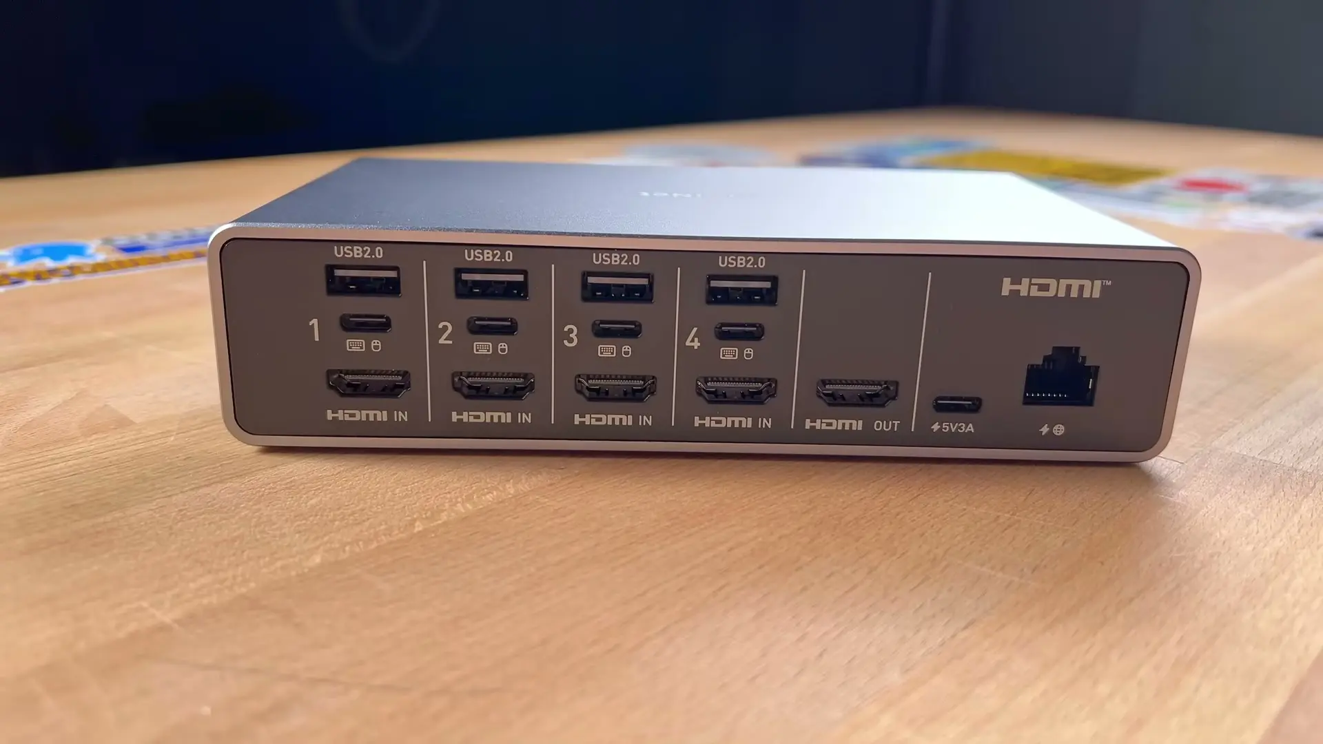 GL.iNet Comet X rear panel with four USB and HDMI inputs, HDMI output, USB-C power, and Ethernet