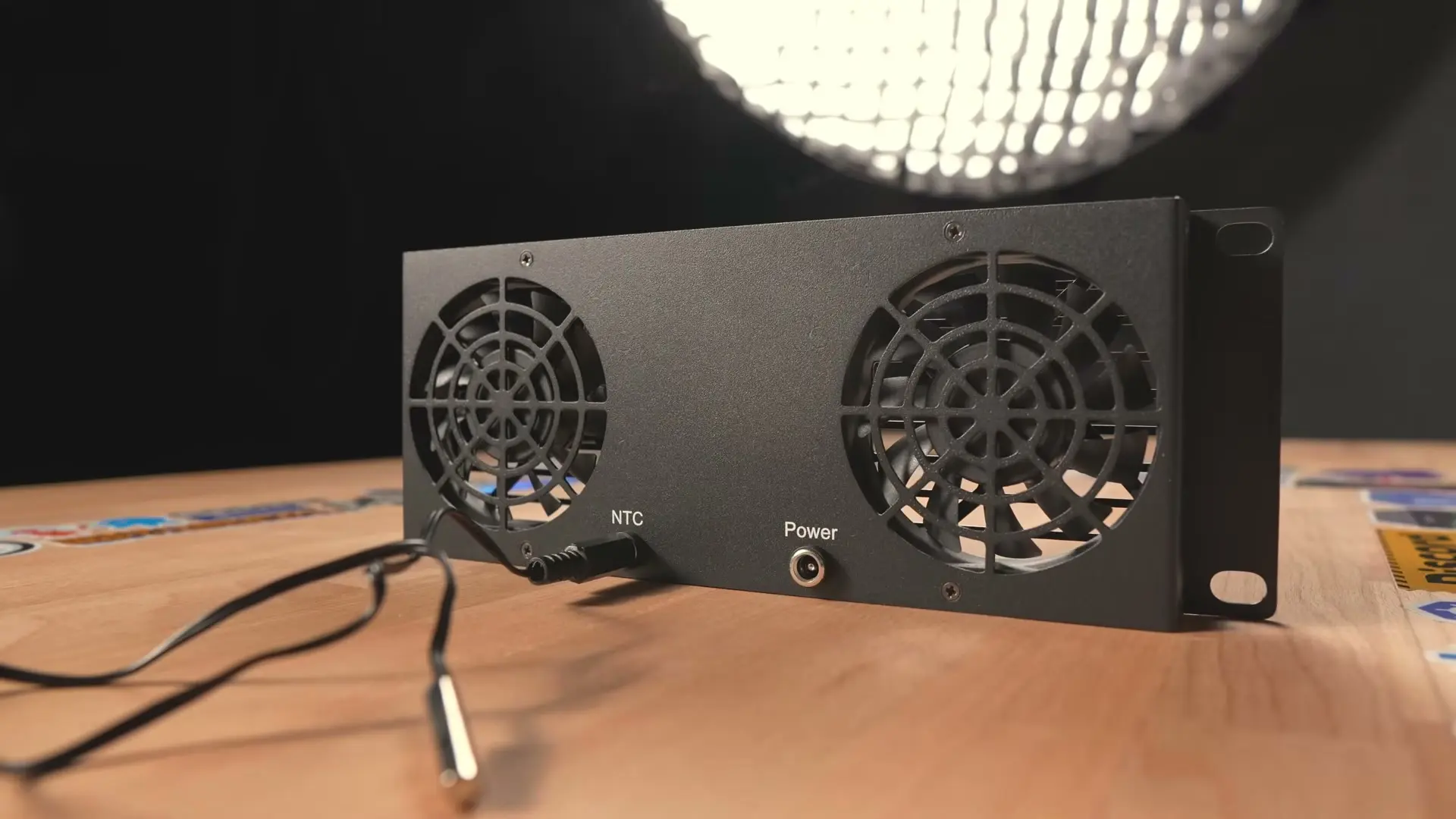 Rear of the DeskPi 2U dual-fan cooling panel with temperature probe and DC power input